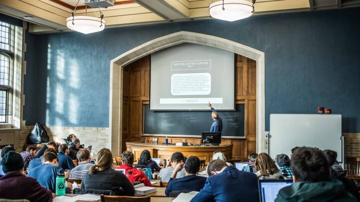 Sam Bagenstos teaching in the front of a classroom full of students