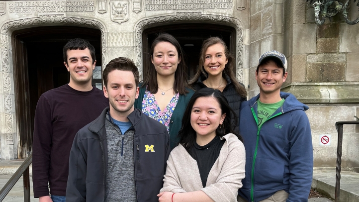 Six students standing in front of the law school after a Best-Ever Vis Moot Finish