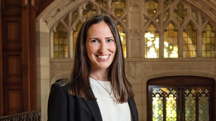 Professor Kristin Wolff standing in the Michigan Law Reading Room