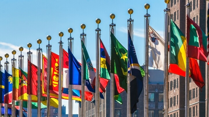 a group of flags on poles