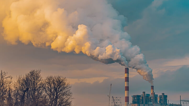 a smokestack with smoke coming out of it