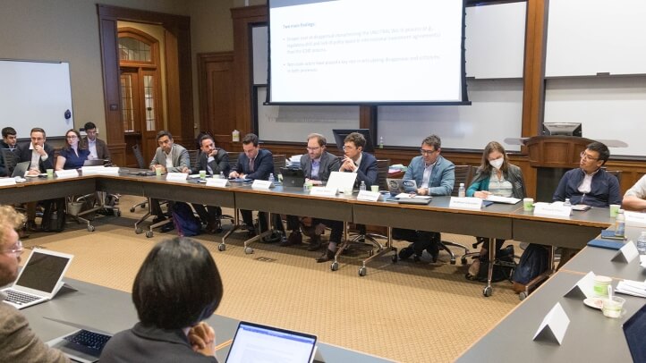 Many people listening to a lecture in the conference room