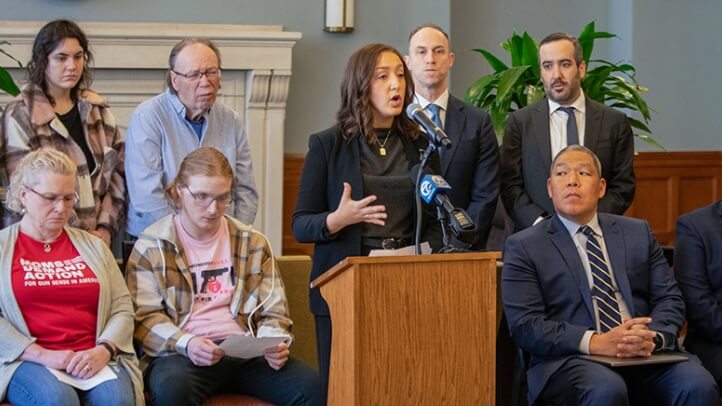 Michigan Law Student speaking from a podium at a press conference.