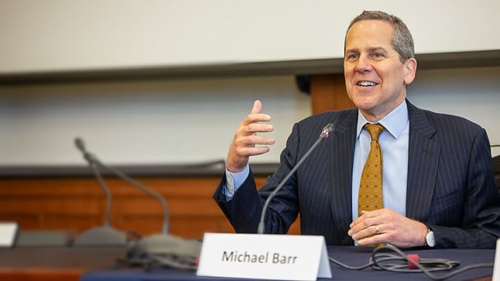Michael Barr speaks in front of an audience at Michigan Law.