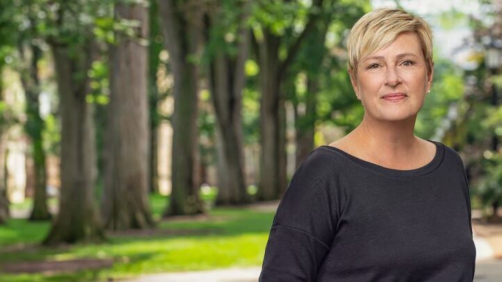 A portait of Mary Buikema standing outside in the Law Quadrangle.