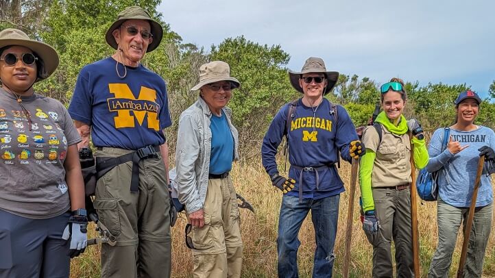 A group of Michigan Law alumni standing outside their volunteer site.