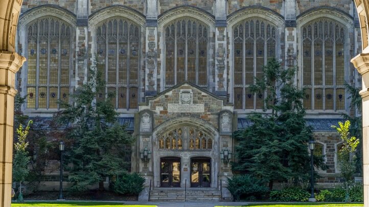 Exterior view of the Reading Room entrance from the Law Quad through a Lawyer's Club archway.