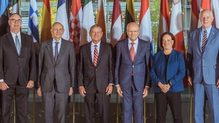 Michigan Law Professor Daniel Halberstam standing next to the US Supreme Court delegation to the Court of Justice of the European Union.