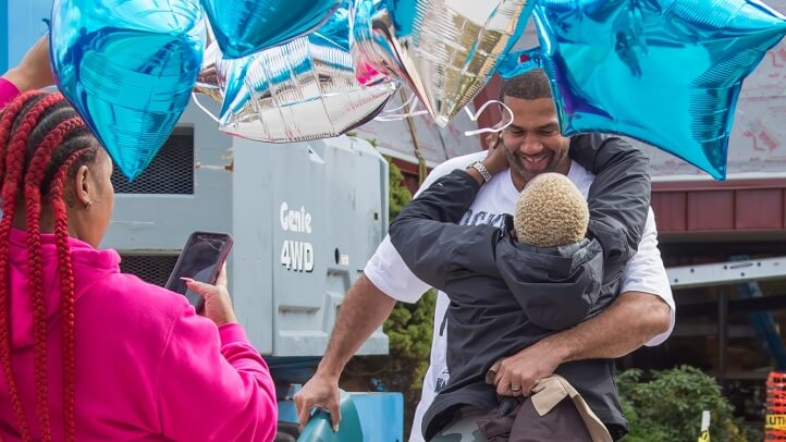 LaVone Hill embraces family after being released.