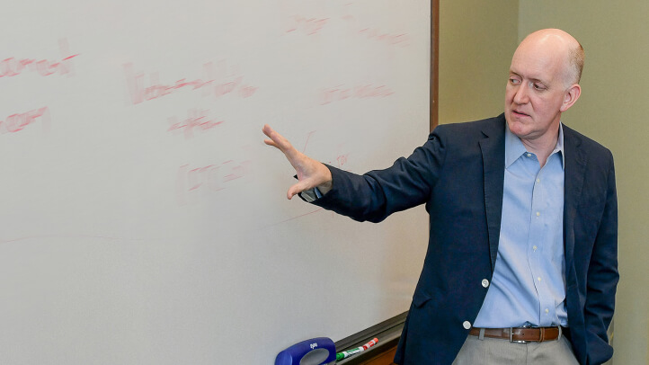 Daniel Crane teaches in front of a class of Michigan Law students.
