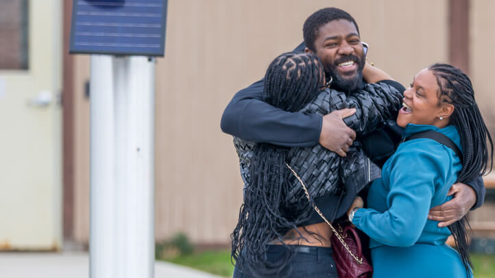 Roy Blackmon embraces his family after being exonerated with the help of the Michigan Law Innocence Clinic.