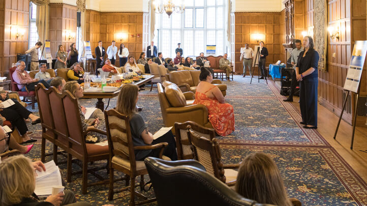 Bridgette Carr and Vivek Sankaran speak to an audience at the Michigan Law AI Showcase in the Lawyers Club Lounge.