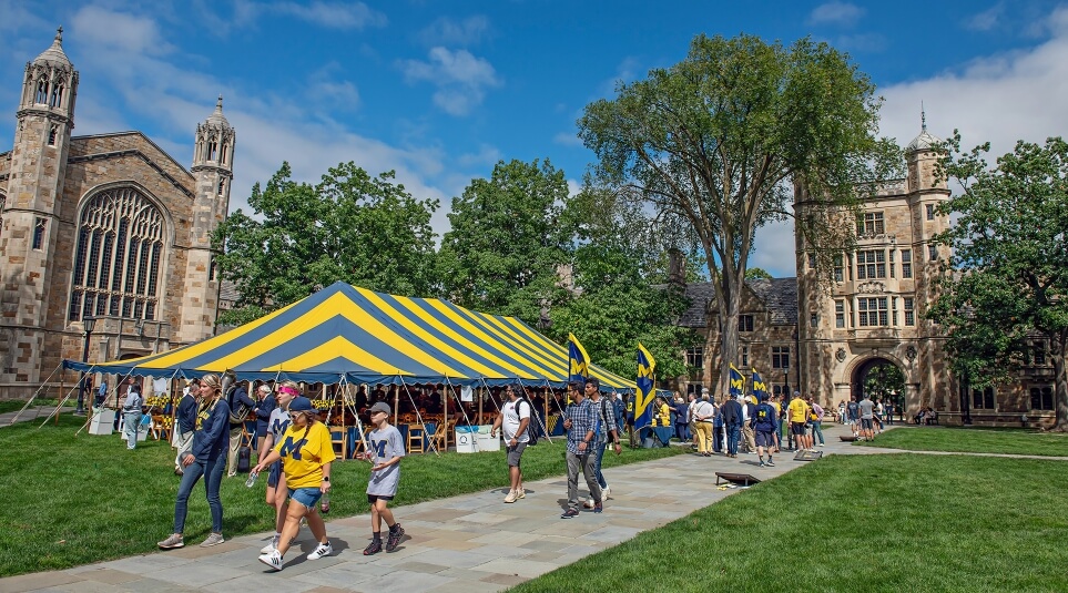 Michigan Law alumni gather for a reunion outside in the Law Quad.