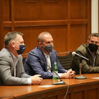 Three People Speaking about the Law of Baseball 