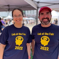 Michigan Law Professor Roseanna Sommers and Nicholas Camp smiling for the camera at the Lab at the Fair.