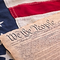 United States Constitution on the American flag.