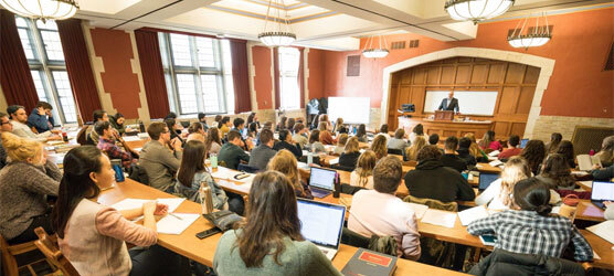 Professor Niehoff teaching a packed classroom